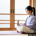 네일아티스트의 스트레스 관리법 - A calm and cozy home setting featuring a young Japanese female nail artist taking a mindful deep abd...